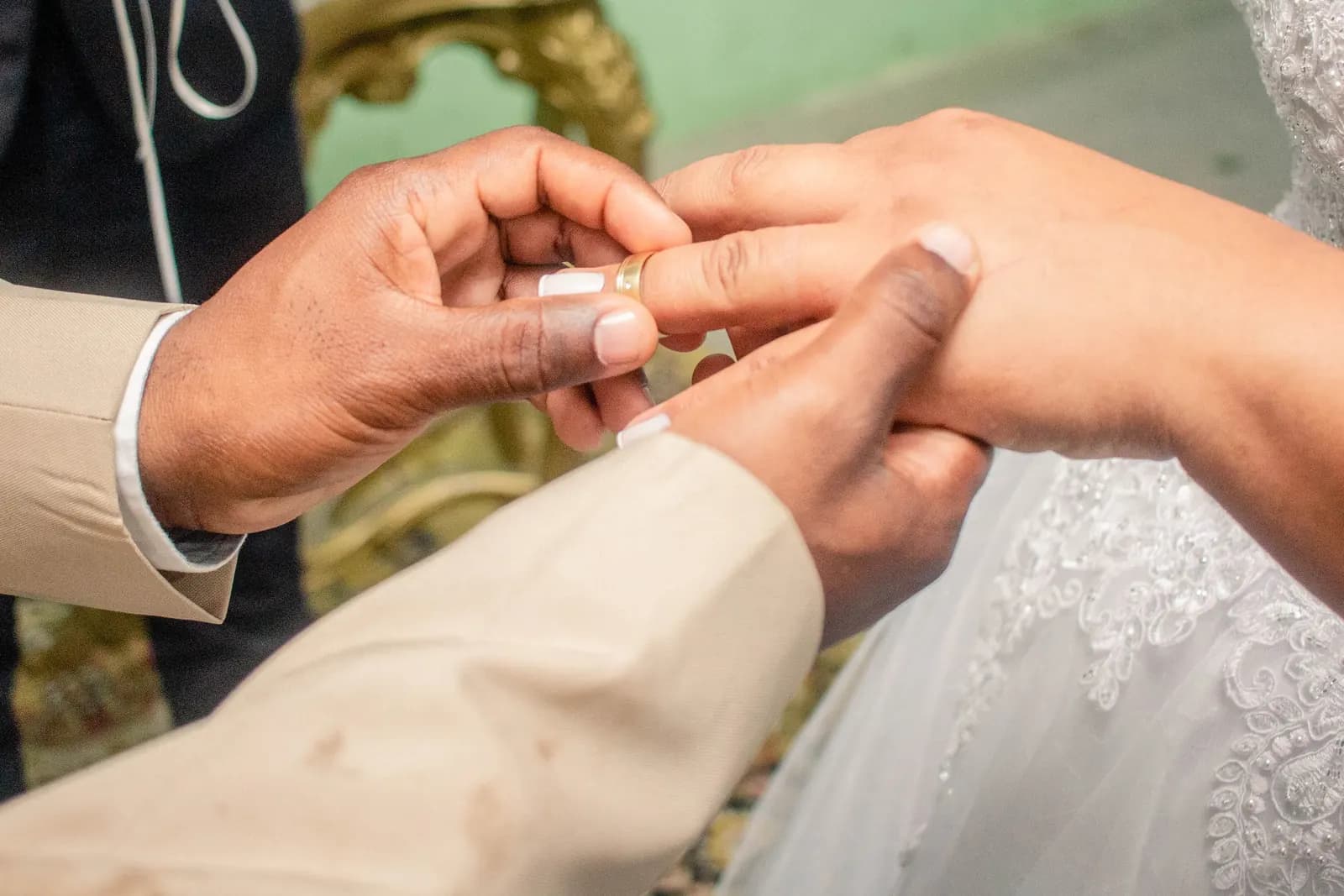 Close-up of a wedding ring exchange