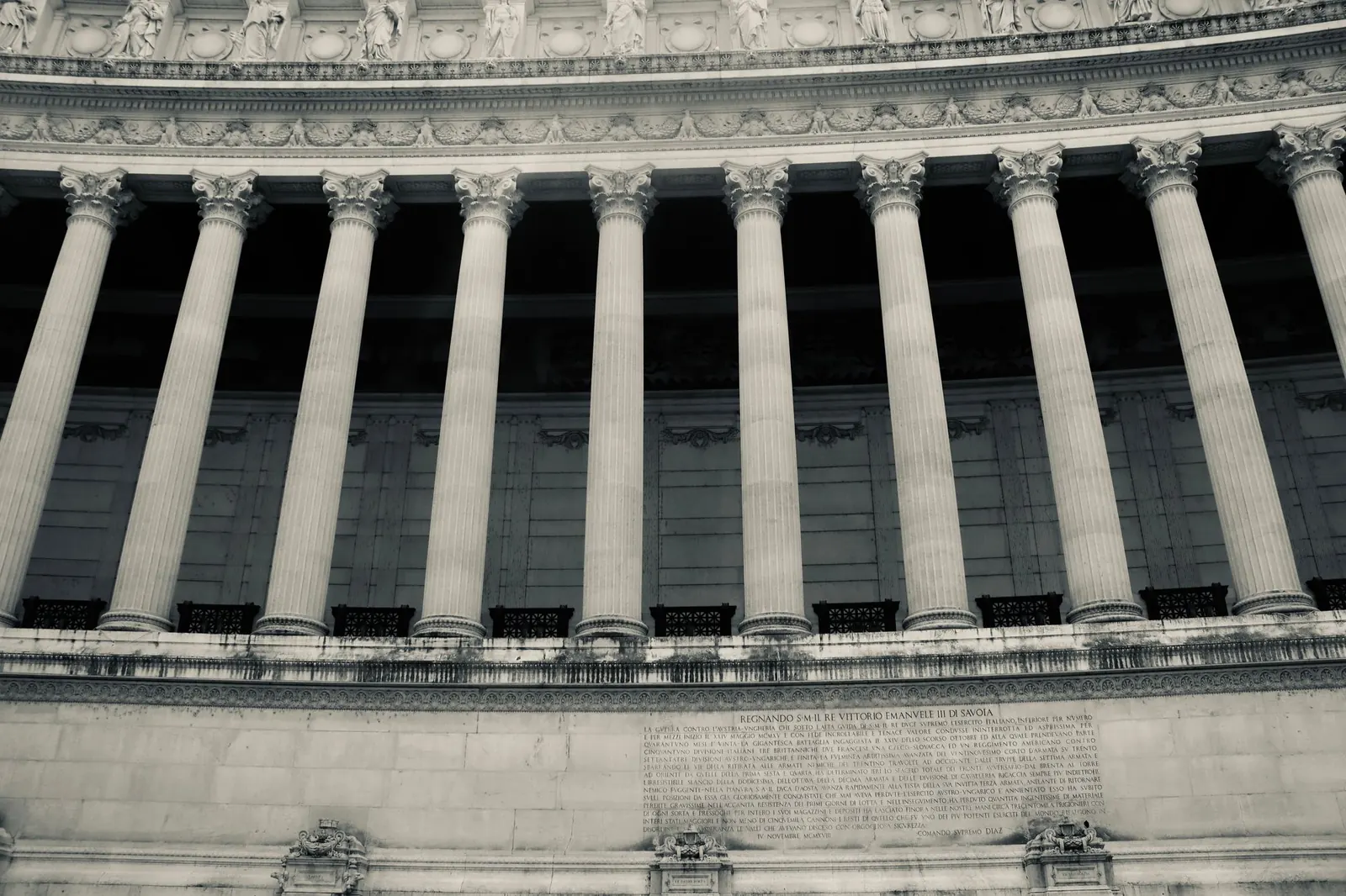 Neoclassical stone columns on the front of a government building.
